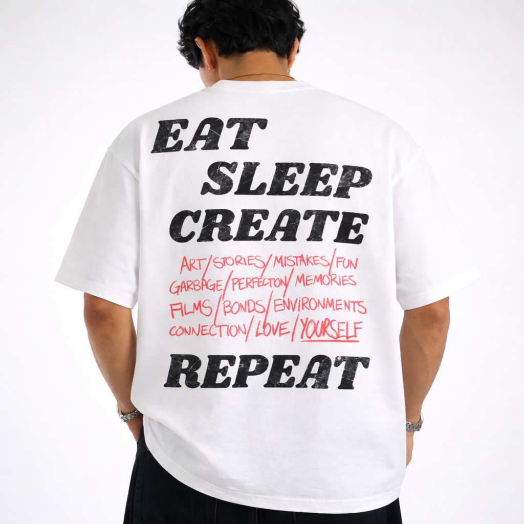 Person wearing a white t-shirt with text on the back