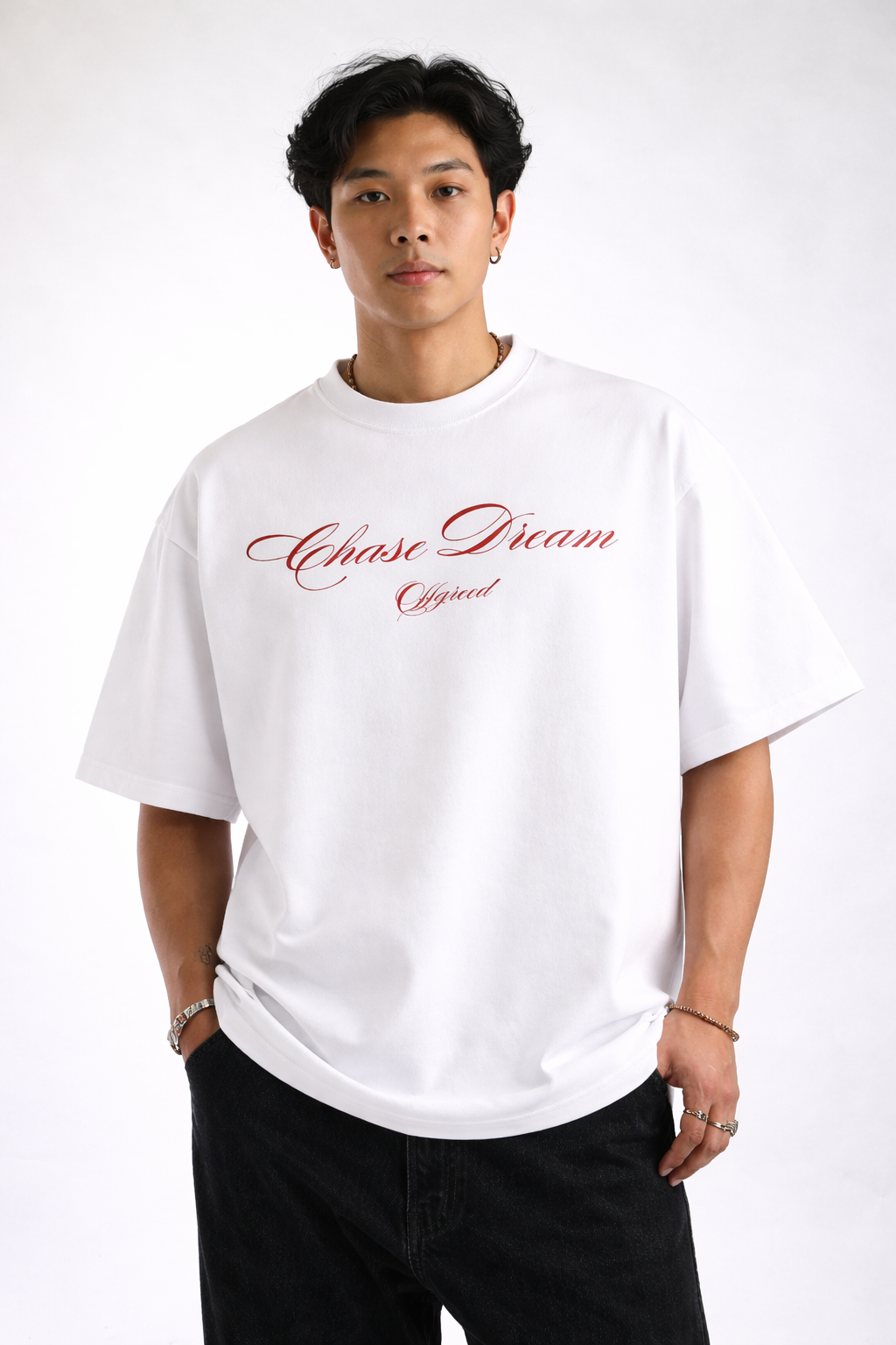 Person wearing a white t-shirt with red text on a white background