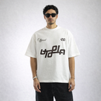 Man wearing a white t-shirt with black graphics and text on a plain background