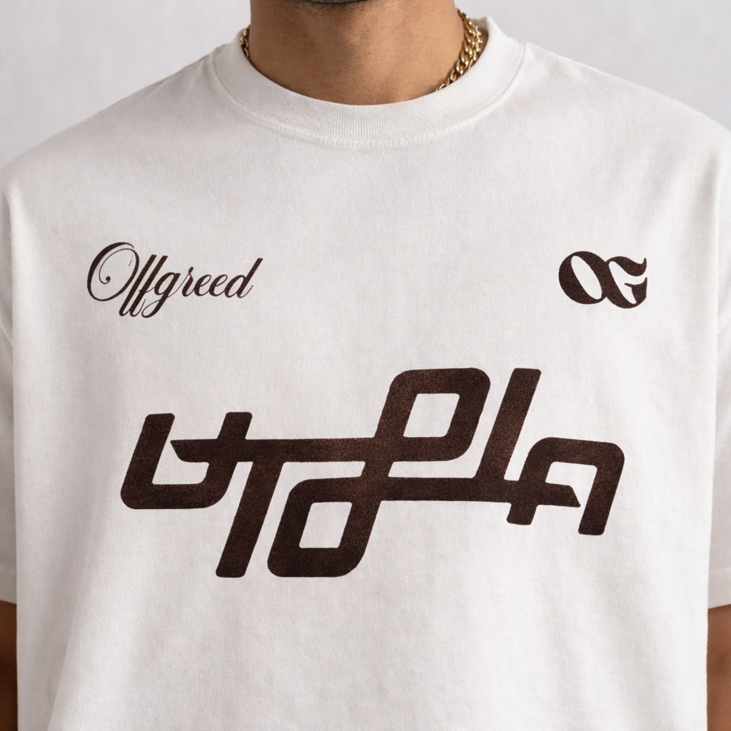 White t-shirt with black text and logo on a plain background