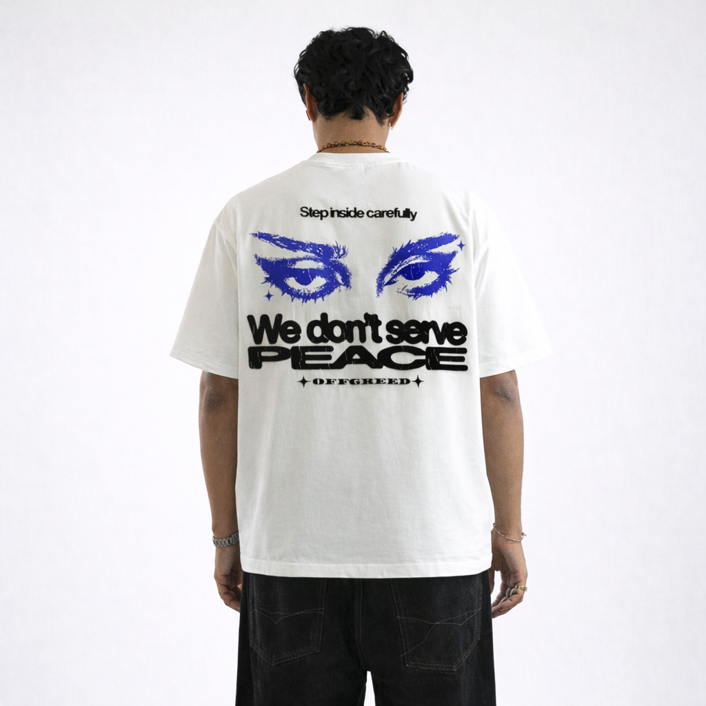 Person wearing a white t-shirt with graphic design and text on the back, standing against a white background.