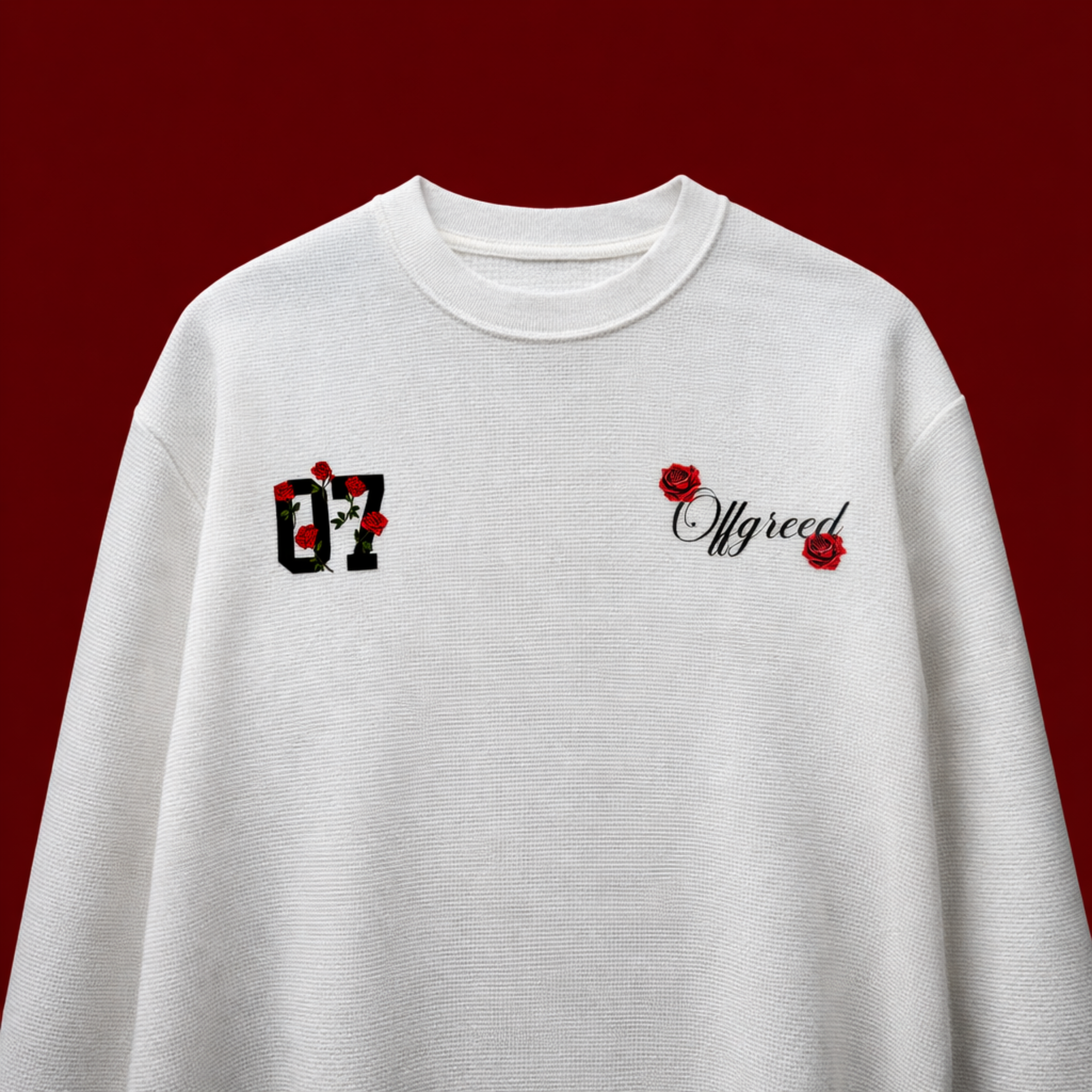 White sweatshirt with black and red designs on a red background